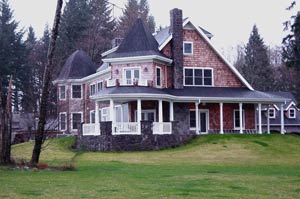 Family home with Victorian shingle-style inspired design